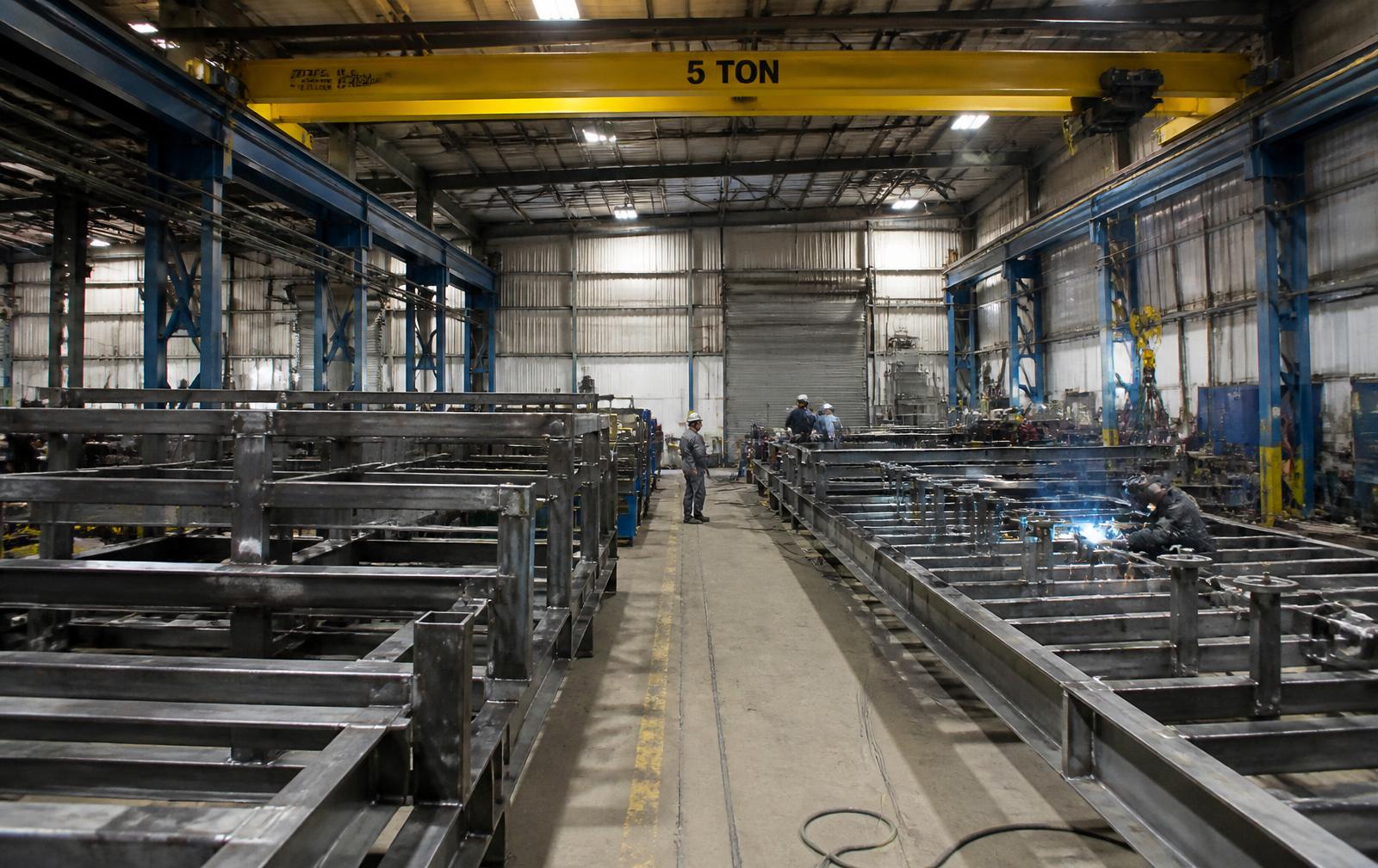 Fabrication workshop with steel skid frames